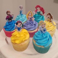 there are many cupcakes that have princesses on them