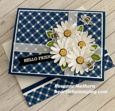 a close up of a card with flowers on it and the words hello friend written in black ink