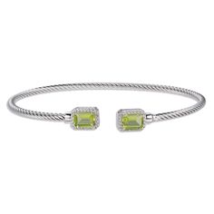 Luscious emerald-cut peridots are the stars of this eye-catching and stylish bangle bracelet, gleaming at either end of the open cuff design. Round white lab-created sapphires sparkle on each side. The bangle is crafted in sterling silver with a rhodium finish and chic rope texturing. Adjustable Elegant Lime Green Jewelry, Modern Green Bangle Jewelry, Modern Green Bangle, Cuff Design, White Lab, Cuff Bangle Bracelet, Bracelet Sterling Silver, Cuff Bangles, Emerald Cut