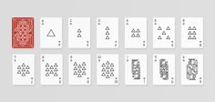 playing cards with different shapes and numbers on them, all lined up in the same pattern