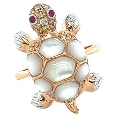 Tortoise White Shell 18K Rose Gold Ring 28 Diamonds 0.30CT 2 Rubies 0.03CT 7 White Pearls 2.45CT 18 K Rose Gold 5.42GM The pearl meaning is centered around purity, balance, and inner wisdom. Pearls have long been a source of pure fascination. Silky and glistening with many shades, these precious gems seem to carry a one-of-a-kind energy. Often tagged as being gifts of grace and glamor, pearls also carry a luminous water energy and a sense of harmony as they are created in synergy with other livi Tortoise Rings For Men, Pearl Meaning, Thali Decoration, K Rose, Water Energy, Beautiful Wallpaper For Phone, Inner Wisdom, Beautiful Wallpaper, The Pearl