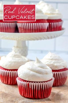 red velvet cupcakes with white frosting on a cake platter and text overlay that says red velvet cupcakes