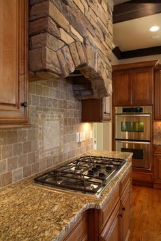 a stove top oven sitting inside of a kitchen next to wooden cabinets and counter tops