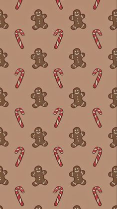 an image of gingerbreads and candy canes on a brown wallpaper background