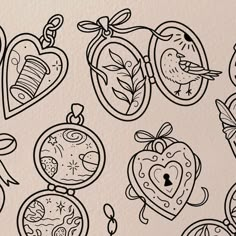 several drawings of clocks and heart shaped objects