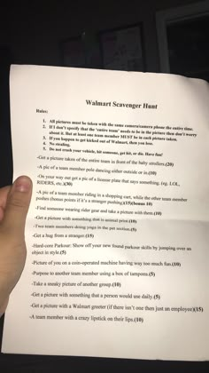 a person holding up a piece of paper with writing on it that says, walmart scavenger hunt