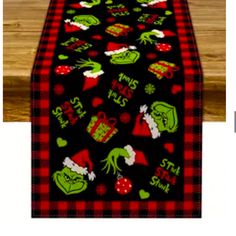 the grinch christmas table runner is on display