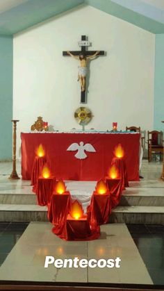 candles are lit in front of the alter