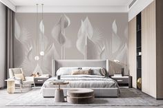 a modern bedroom with white furniture and large wallpapered leaves on the walls behind it