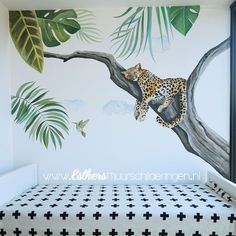 a bedroom with a leopard mural on the wall