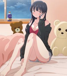 a woman sitting on a bed talking on a cell phone next to two teddy bears