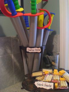 a bunch of pencils that are sitting in a cup on a table with some writing on them