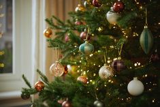 a christmas tree with ornaments hanging from it