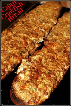 some type of bread that is cut in half and sitting on a black surface with the words cauliflower gravy bread