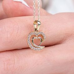 ✥ Celebrate a milestone with our Intertwined Hearts Diamond Necklace, an ideal anniversary gift. This exquisite necklace features two hearts intricately intertwined, symbolizing the deep connection and enduring love between two people. Adorned with sparkling diamonds, it adds brilliance and elegance to any ensemble. Crafted from high-quality materials for lasting beauty and durability, it's perfect for daily wear or special occasions. A heartfelt expression of love and commitment, this necklace is a meaningful and cherished reminder of shared memories and milestones. ✦ Stone Details:✧ Stone Type: Moissanite✧ Stone Cut: Round Cut✧ Stone Total Weight: 0.19CT ✧ Color: DEF✧ Clarity: VVS✧ Make: Hight Quality Craftmanship ✦ Metal Details✧ Metal Type: Solid Gold✧ Metal Purity: Available Options:1 Elegant Double Heart Cubic Zirconia Necklace, Fine Jewelry Double Heart Necklace For Wedding, Elegant Double Heart Necklace For Wedding, Elegant Heart Necklace With Birthstone In Cubic Zirconia, Elegant Heart Necklace With Birthstone And Cubic Zirconia, Elegant Cubic Zirconia Heart Necklace With Birthstone, Elegant Heart-shaped Necklace As A Gift For Her, Gold Necklaces With Elegant Design For Anniversary, Double Heart Diamond Necklace Gift