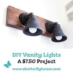 two light fixtures mounted on a wall with the words diy vanity lights $ 75 project