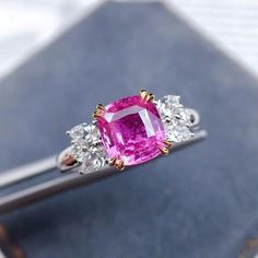 Pink Sapphire and Diamond Engagement Ring:Main Stone: Natural Pink Sapphire 1.4-1.5 ct Side Stones: Natural Diamonds 0.4 ct Metal: 14K Solid GoldCustom Order:This Unique Pink Sapphire Engagement Ring can be customised in Rose,White and Yellow Gold. The Sapphire has a gorgeous pink color. This stunning sapphire ring is offered in other sizes, metal, and the central stone can be upgraded/downgraded to suit your preference and budget. We have a great selection of Sapphires as well as other natural Luxury Pink Sapphire Classic Diamond Ring, Gia Certified Pink Diamond Ruby Ring, Gia Certified Pink Sapphire Diamond Ring In Fine Jewelry, Gia Certified Pink Sapphire Diamond Ring, Gia Certified Fine Jewelry Pink Sapphire Diamond Ring, Gia Certified White Gold Pink Sapphire Jewelry, Fine Jewelry Gia Certified Pink Sapphire Diamond Ring, Gia Certified Rose Gold Cubic Zirconia Rings, Gia Certified Rose Gold Diamond Ring