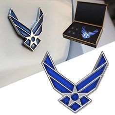 the emblems on the back of a car are blue and white with an eagle