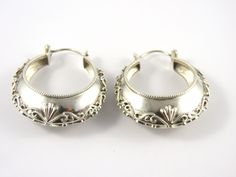 This is a pair of sterling silver large round hoop, pierced earrings. The earrings  are 1 1/2" wide with a raised design in the center and polished borders and small beaded edges .  The earrings have  push in silver posts and have a frosted inside finish.   The earring measures 1 3/4" long x  1 1/2"wide The total weight is 18.59 grams. Marked :   Nepal  925  PTI Inventory # 4297 Silver Hoop Jewelry With Engraving, Silver Oval Hoop Earrings For Wedding, Vintage Silver Hoop Earrings For Wedding, Traditional Engraved Round Hoop Earrings, Engraved Silver Hoop Jewelry, Silver Engraved Hoop Jewelry, Silver Engraved Hoop Earrings For Anniversary, Engraved Silver Hoop Earrings For Anniversary, Silver Engraved Small Hoop Earrings