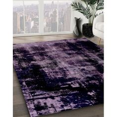 an area rug with purple and black colors