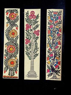 three hand painted bookmarks with flowers and leaves on them, one in the shape of a tree