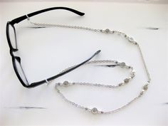 "Glasses chain with silver beads, and Necklace combination handmade by Ralston Originals. Unique from any other Glasses Chains on Etsy, Ralston Originals was the first to add the lobster clasp at the end of the chain to join together to make a Necklace. Brilliant! This makes it even more unique because you now have two pieces of jewelry in one!!. Wear it to work or out shopping as a Necklace, then wear it as an Eyeglass Chain as needed. I hated always having to reach into my purse looking for my Silver Beaded Glass Chain For Glasses, Silver Beaded Metal Glasses Chain, Silver Metal Beaded Glasses Chain, Silver Glass Jewelry With Beaded Chain, Adjustable Silver Beaded Glasses Chain, Adjustable Silver Metal Glasses Chains, Adjustable Silver Glasses Chains For Parties, Silver Beaded Glasses Chains With Round Beads, Handmade Silver Glasses Chains For Gift