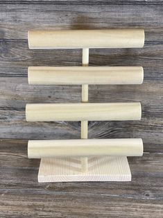 three wooden pegs are stacked on top of each other