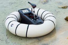 an inflatable boat is sitting on the beach