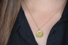 Gold coin necklace, gold coin pendant, coin necklace, antique necklace, delicate gold necklace, everyday gold necklace, bridesmaid necklace Delicate gold necklace with an old british gold coin pendant, great for everyday wear, unique and beautiful. The gold coin necklace is made of 14k gold filled and the gold pendant is an original coin which I decorate with twisted brass wires and plated with 14k gold. The coin necklace is also available in sterling silver. Dimensions: The coin pendant's diame Yellow Gold Brass Coin Necklace With Delicate Chain, Gold Plated Coin Pendant Necklace For Wedding, Elegant Coin Pendant Necklace For Wedding, Gold Plated Dainty Medallion Necklace, Dainty Brass Necklace With Coin Pendant, Dainty Brass Charm Necklace With Coin Pendant, Dainty Gold Plated Medallion Coin Necklace, Elegant Coin Shaped Locket Necklace, Elegant Coin-shaped Locket Necklace