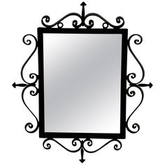 a black and white photo of a mirror with an ornate design on the bottom half