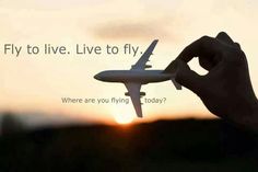 a person holding an airplane in their hand with the words fly to live, live to fly where are you flying today?