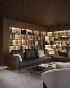 a living room filled with lots of furniture and bookshelves on the wall next to each other