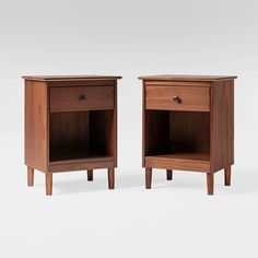 two wooden nightstands side by side with one drawer open and the other closed on both sides