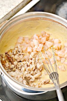 the food is being prepared and ready to be cooked in the pot on the stove