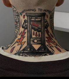 the back of a person's neck with tattoos on it and writing that says anything to