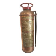 an old fashioned fire extinguisher with nozzles on it's side