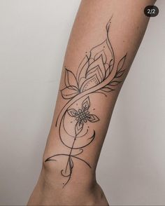 a woman's arm with a tattoo on it and a flower in the middle