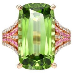 Luminous 14.40 carat elongated Peridot cushion, 18K rose gold ring, decorated with a total of 0.52 carat Pink Sapphires and a total of 0.37 carat round brilliant diamonds. Ring size 6.5. Resizing is complementary upon request. Returns are accepted and paid by us within 7 days of delivery. Please FOLLOW the MERKABA storefront to be the first to view the latest of our ultra exclusive jewels and supreme gemstones. Merkaba Jewelry, is a unique, world-class jewelry brand, dedicated to unveiling the rarest, finest and most sought-after gemstones globally, such as Alexandrite, Paraiba Tourmaline, "no oil" Emeralds, unheated Sapphires and Rubies, Padparadscha Sapphire, Aquamarine, Tsavorite, Spinel, Mandarin Garnet, Chrome Tourmaline, Cat's Eye Chrysoberyl, Star Ruby and Star Sapphire, Demantoid G Class Jewelry, Mandarin Garnet, Chrome Tourmaline, Padparadscha Sapphire, Paraiba Tourmaline, Star Sapphire, Diamonds Ring, Star Ruby, Peridot Ring