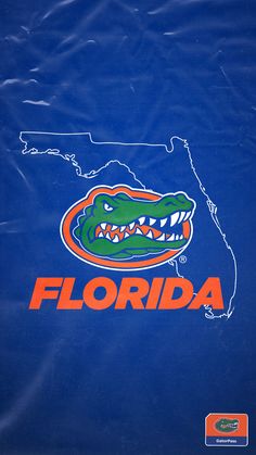 the florida gators logo is shown on a blue background