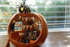 a carved pumpkin with decorations on it