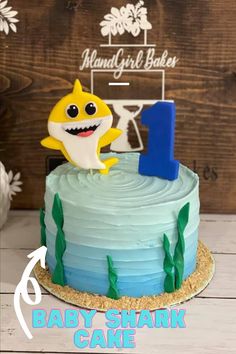 a baby shark cake with the number one on it