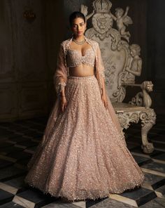 This lehenga features sequin, pearl and crystal embroidery and a scalloped ghera. The back tie blouse has pearl and crystal drops. The scalloped dupatta and lehenga shows pearl and crystal drops.From Seema Gujral's Inara collection. DELIVERY TIMEPlease allow 8-12 weeks for your outfit to arrive. FABRIC DETAILSNet Professional cleaning only. Back Tie Blouse, Bridal Asia, Sequin Lehenga, Seema Gujral, Chinese Fancy Dress, Gold Lehenga, Mirror Work Lehenga, Organza Lehenga, Crystal Embroidery