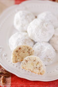 a white plate topped with snowball cookies