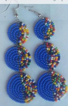 This is an African beaded pair of earrings that is carefully joined together using a beading wire.Its a simple yet a very stylish earrings. Blue Round Beaded Earrings With Colorful Beads, Bohemian Blue Earrings With Polished Beads, Blue Bohemian Earrings With Polished Beads, Colorful Round Beaded Earrings, Blue Chandelier Earrings With Colorful Round Beads, Traditional Blue Beaded Earrings, Blue Beaded Chain Drop Earrings, Blue Polished Beaded Earrings For Gifts, Blue Large Beads Drop Earrings