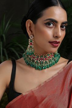 A beautifully handcrafted neckpiece worked in gold, finished with an array of semi-precious gemstone drops and encrusted with kundan. This choker set is based in silver alloy plated with 22k gold. Necklace Closure - Adjustable Dori Earrings Closure - Push Back Necklace - 14 inches Earrings - 3.5 inches Style Tip - A perfect choker for someone who's styling decisions always start and end with putting timeless classics together to create a magical and unique look. An accessory so versatile, we are Green Temple Jewelry Necklaces With Stones, Green Temple Jewelry Necklace With Stones, Festive Temple Jewelry Necklaces With Stones, Kundan Necklaces With Stones For Gift, Kundan Necklaces With Stones As Gifts, Temple Jewelry Chandbali Necklaces With Multi-stone, Temple Jewelry Chandbali Multi-stone Necklace, Traditional Multi-stone Ceremonial Necklaces, Traditional Festive Necklaces With Stones