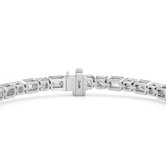 Versatile enough for every occasion and season, this diamond tennis bracelet pairs effortlessly when dressed up or down. It has the seamless blend of effortless elegance and timeless style with its combination of cushion diamonds on v-prongs and emerald-cut diamonds on bezels. Classic Diamond Tennis Bracelet Baguette Cut, Anniversary Diamond Bracelet With Rectangular Links, Classic Baguette Cut Tennis Bracelet, Modern Diamond Cut Tennis Bracelet For Anniversary, Classic Tennis Bracelet With Baguette Cut And Prong Setting, Diamond Bracelets With Rectangular Links For Anniversary, Classic Baguette Cut Tennis Bracelet For Anniversary, Diamond Tennis Bracelet With Rectangular Links And Diamond Accents, Timeless White Gold Tennis Bracelet With Baguette Cut