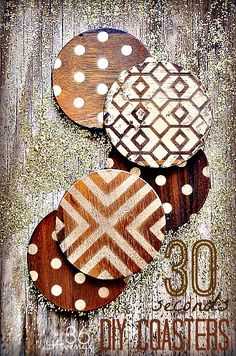 three wooden plates sitting on top of a wooden table with polka dots and chevron designs