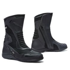 a pair of black motorbike boots with zippers on the sides and side