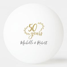 a white and gold 50th anniversary ornament