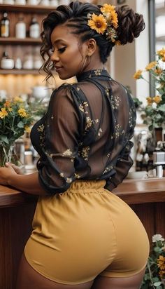 a woman standing in front of a bar with flowers on her head and wearing high waist shorts